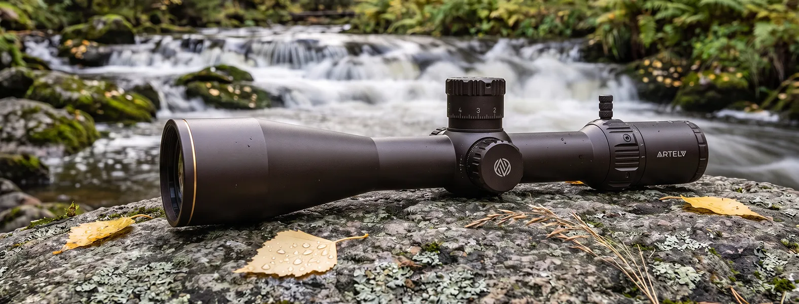 Оптический прицел ARTELV AIMSET 5-25x56 FFP 34 на камне у водопада
